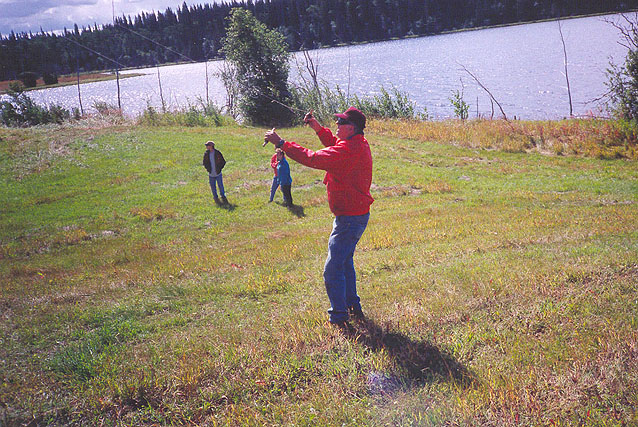 Eldon Lendon flying a kite at Bedore Lake.